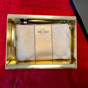 Gold Coach wristlet. NWT